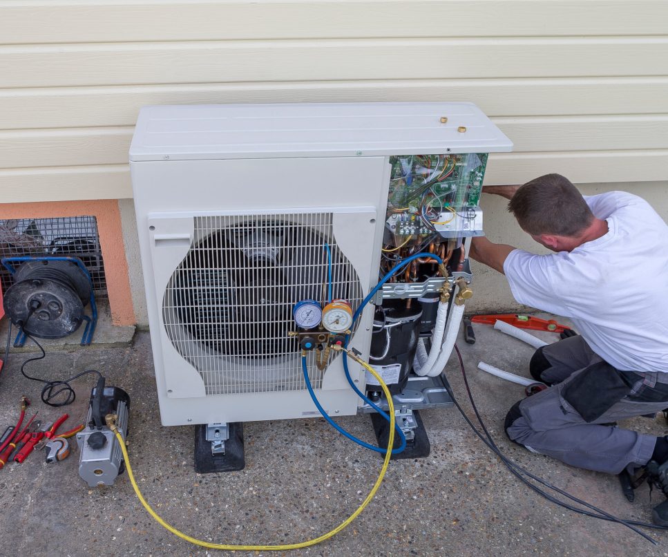 heat Pump. plumber at work installing a circulation pump
