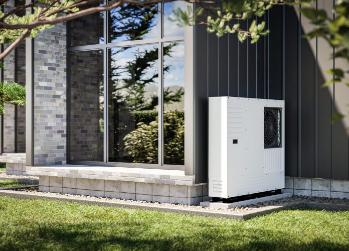 Heat pump installed at the wall of a single-family house 3d render showing renewable energy sources.