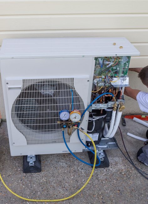 plumber at work installing a circulation pump